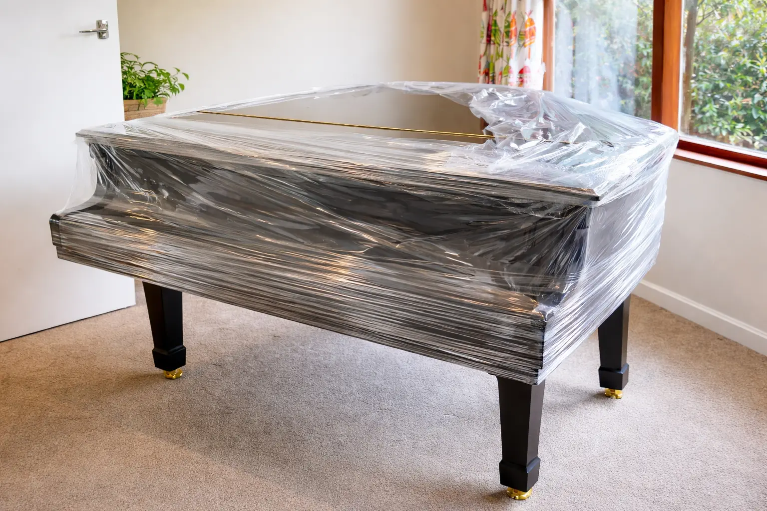 Piano à queue protégé avant son transport